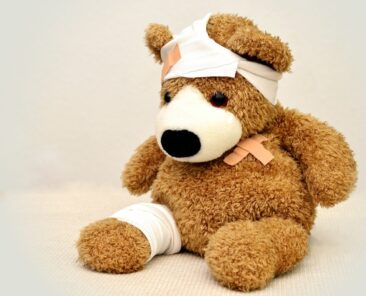 Teddy bear with bandages and plasters